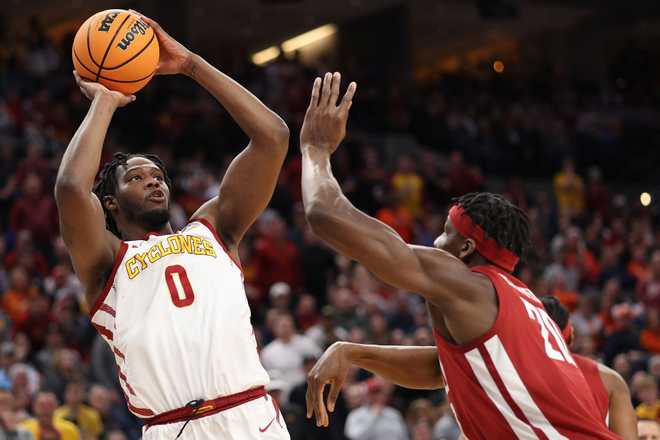 OMAHA,&#x20;NEBRASKA&#x20;-&#x20;MARCH&#x20;23&#x3A;&#x20;Tre&#x20;King&#x20;&#x23;0&#x20;of&#x20;the&#x20;Iowa&#x20;State&#x20;Cyclones&#x20;shoots&#x20;the&#x20;ball&#x20;against&#x20;Rueben&#x20;Chinyelu&#x20;&#x23;20&#x20;of&#x20;the&#x20;Washington&#x20;State&#x20;Cougars&#x20;during&#x20;the&#x20;second&#x20;half&#x20;in&#x20;the&#x20;second&#x20;round&#x20;of&#x20;the&#x20;NCAA&#x20;Men&amp;apos&#x3B;s&#x20;Basketball&#x20;Tournament&#x20;at&#x20;CHI&#x20;Health&#x20;Center&#x20;on&#x20;March&#x20;23,&#x20;2024&#x20;in&#x20;Omaha,&#x20;Nebraska.&#x20;&#x28;Photo&#x20;by&#x20;Jamie&#x20;Squire&#x2F;Getty&#x20;Images&#x29;