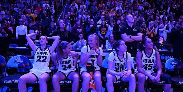 ALBANY,&#x20;NEW&#x20;YORK&#x20;-&#x20;APRIL&#x20;01&#x3A;&#x20;Caitlin&#x20;Clark&#x20;&#x23;22,&#x20;Gabbie&#x20;Marshall&#x20;&#x23;24,&#x20;Sydney&#x20;Affolter&#x20;&#x23;3,&#x20;Kate&#x20;Martin&#x20;&#x23;20,&#x20;and&#x20;Hannah&#x20;Stuelke&#x20;&#x23;45&#x20;of&#x20;the&#x20;Iowa&#x20;Hawkeyes&#x20;wait&#x20;to&#x20;be&#x20;introduced&#x20;during&#x20;pregame&#x20;ceremonies&#x20;against&#x20;the&#x20;LSU&#x20;Tigers&#x20;during&#x20;the&#x20;Elite&#x20;Eight&#x20;round&#x20;of&#x20;the&#x20;2024&#x20;NCAA&#x20;Women&amp;apos&#x3B;s&#x20;Basketball&#x20;Tournament&#x20;held&#x20;at&#x20;MVP&#x20;Arena&#x20;on&#x20;April&#x20;1,&#x20;2024&#x20;in&#x20;Albany,&#x20;New&#x20;York.&#x20;&#x28;Photo&#x20;by&#x20;Greg&#x20;Fiume&#x2F;NCAA&#x20;Photos&#x20;via&#x20;Getty&#x20;Images&#x29;