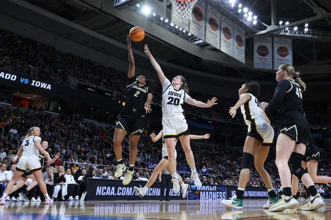 ALBANY,&#x20;NEW&#x20;YORK&#x20;-&#x20;MARCH&#x20;30&#x3A;&#x20;Tameiya&#x20;Sadler&#x20;&#x23;2&#x20;of&#x20;the&#x20;Colorado&#x20;Buffaloes&#x20;shoots&#x20;against&#x20;Kate&#x20;Martin&#x20;&#x23;20&#x20;of&#x20;the&#x20;Iowa&#x20;Hawkeyes&#x20;during&#x20;the&#x20;first&#x20;half&#x20;in&#x20;the&#x20;Sweet&#x20;16&#x20;round&#x20;of&#x20;the&#x20;NCAA&#x20;Women&amp;apos&#x3B;s&#x20;Basketball&#x20;Tournament&#x20;at&#x20;MVP&#x20;Arena&#x20;on&#x20;March&#x20;30,&#x20;2024&#x20;in&#x20;Albany,&#x20;New&#x20;York.&#x20;&#x28;Photo&#x20;by&#x20;Andy&#x20;Lyons&#x2F;Getty&#x20;Images&#x29;
