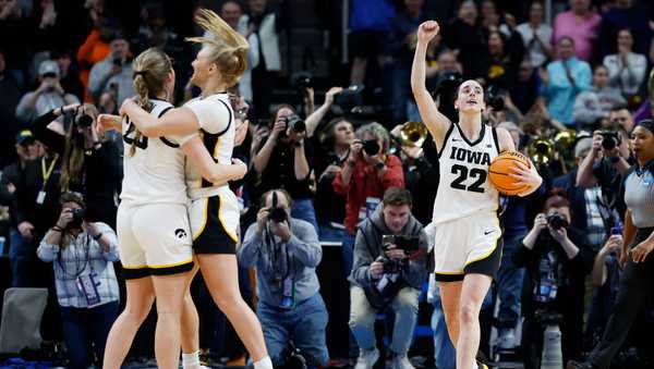 ALBANY, NEW YORK - APRIL 01: Caitlin Clark #22 of the Iowa Hawkeyes and her teammates celebrate after beating the LSU Tigers 94-87 in the Elite 8 round of the NCAA Women's Basketball Tournament at MVP Arena on April 01, 2024 in Albany, New York. (Photo by Sarah Stier/Getty Images)