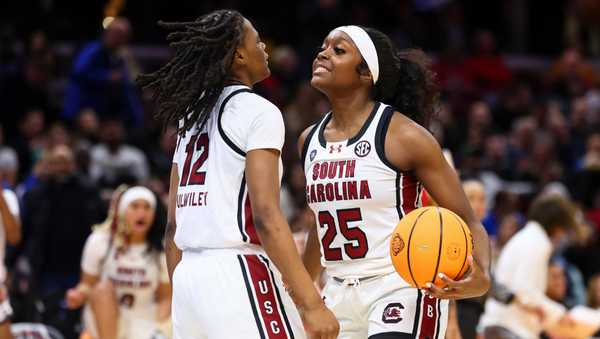 CLEVELAND, OHIO - APRIL 5: Raven Johnson #25 of the South Carolina Gamecocks celebrates with MiLaysia Fulwiley #12 of the South Carolina Gamecocks against the NC State Wolfpack during the NCAA Women's Basketball Tournament Final Four semifinal game at Rocket Mortgage Fieldhouse on April 5, 2024 in Cleveland, Ohio. (Photo by C. Morgan Engel/NCAA Photos via Getty Images)