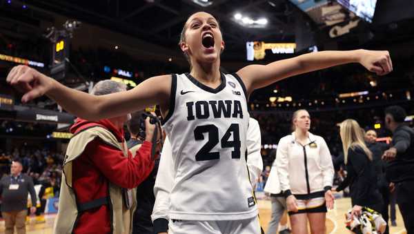 CLEVELAND, OHIO - APRIL 05: Gabbie Marshall #24 of the Iowa Hawkeyes celebrates after beating the UConn Huskies in the NCAA Women's Basketball Tournament Final Four semifinal game at Rocket Mortgage Fieldhouse on April 05, 2024 in Cleveland, Ohio. Iowa defeated Connecticut 71-69 (Photo by Steph Chambers/Getty Images)