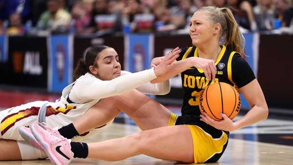 CLEVELAND, OHIO - APRIL 07: Tessa Johnson #5 of the South Carolina Gamecocks and Sydney Affolter #3 of the Iowa Hawkeyes fight for the ball in the second half during the 2024 NCAA Women's Basketball Tournament National Championship at Rocket Mortgage FieldHouse on April 07, 2024 in Cleveland, Ohio. (Photo by Gregory Shamus/Getty Images)