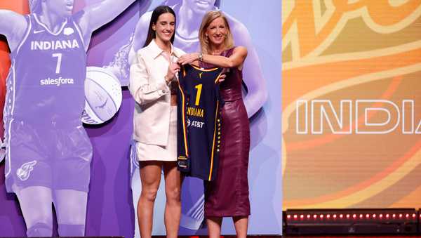 NEW YORK, NEW YORK - APRIL 15: Caitlin Clark poses with WNBA Commissioner Cathy Engelbert after being selected first overall pick by the Indiana Fever during the 2024 WNBA Draft at Brooklyn Academy of Music on April 15, 2024 in New York City. (Photo by Sarah Stier/Getty Images)