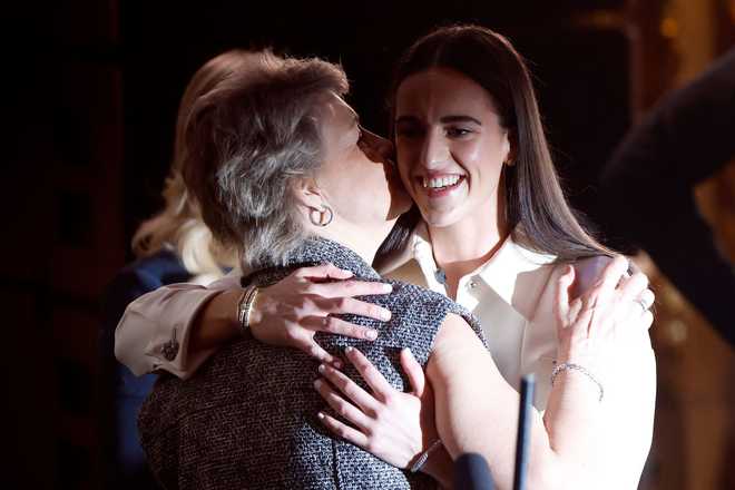 NEW&#x20;YORK,&#x20;NEW&#x20;YORK&#x20;-&#x20;APRIL&#x20;15&#x3A;&#x20;Head&#x20;coach&#x20;Lisa&#x20;Bluder&#x20;of&#x20;the&#x20;Iowa&#x20;Hawkeyes&#x20;kisses&#x20;Caitlin&#x20;Clark&#x20;after&#x20;being&#x20;selected&#x20;first&#x20;overall&#x20;pick&#x20;by&#x20;the&#x20;Indiana&#x20;Fever&#x20;during&#x20;the&#x20;2024&#x20;WNBA&#x20;Draft&#x20;at&#x20;Brooklyn&#x20;Academy&#x20;of&#x20;Music&#x20;on&#x20;April&#x20;15,&#x20;2024&#x20;in&#x20;New&#x20;York&#x20;City.&#x20;&#x28;Photo&#x20;by&#x20;Sarah&#x20;Stier&#x2F;Getty&#x20;Images&#x29;
