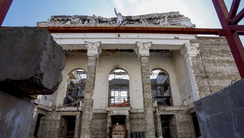 Russia opens rebuilt theater in occupied city more than 3 years after its airstrikes killed hundreds there