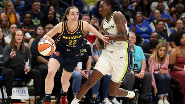 ARLINGTON, TEXAS - MAY 03: Caitlin Clark #22 of the Indiana Fever drives to the basket against the Dallas Wings during the first quarter in the preseason game at College Park Center on May 03, 2024 in Arlington, Texas.  (Photo by Gregory Shamus/Getty Images)