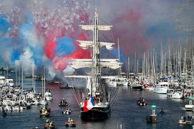 French&#x20;19th-century&#x20;three-masted&#x20;barque&#x20;Belem&#x20;&#x28;C&#x29;&#x20;arrives&#x20;at&#x20;the&#x20;Vieux-Port&#x20;&#x28;Old&#x20;Port&#x29;&#x20;as&#x20;red&#x20;white&#x20;and&#x20;blue&#x20;fireworks&#x20;are&#x20;fired,&#x20;during&#x20;the&#x20;Olympic&#x20;Flame&#x20;arrival&#x20;ceremony,&#x20;as&#x20;part&#x20;of&#x20;its&#x20;journey&#x20;ahead&#x20;of&#x20;the&#x20;Paris&#x20;2024&#x20;Olympic&#x20;and&#x20;Paralympic&#x20;Games,&#x20;in&#x20;Marseille,&#x20;southeastern&#x20;France,&#x20;on&#x20;May&#x20;8,&#x20;2024.&#x20;The&#x20;transfer&#x20;of&#x20;the&#x20;flame&#x20;onshore&#x20;from&#x20;a&#x20;19th-century&#x20;tall&#x20;ship&#x20;will&#x20;mark&#x20;the&#x20;start&#x20;of&#x20;a&#x20;12,000-kilometre&#x20;&#x28;7,500-mile&#x29;&#x20;torch&#x20;relay&#x20;across&#x20;mainland&#x20;France&#x20;and&#x20;the&#x20;country&amp;apos&#x3B;s&#x20;far-flung&#x20;overseas&#x20;territories.&#x20;&#x28;Photo&#x20;by&#x20;Sylvain&#x20;THOMAS&#x20;&#x2F;&#x20;AFP&#x29;&#x20;&#x28;Photo&#x20;by&#x20;SYLVAIN&#x20;THOMAS&#x2F;AFP&#x20;via&#x20;Getty&#x20;Images&#x29;
