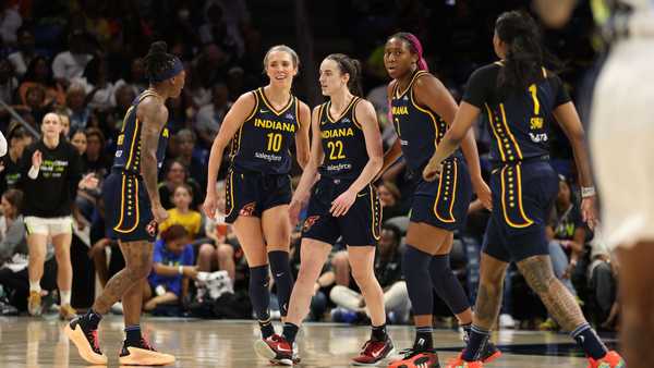 ARLINGTON, TEXAS - MAY 03: Caitlin Clark #22 of the Indiana Fever celebrates with teammates while playing the Dallas Wings during a pre season game at College Park Center on May 03, 2024 in Arlington, Texas.  (Photo by Gregory Shamus/Getty Images)