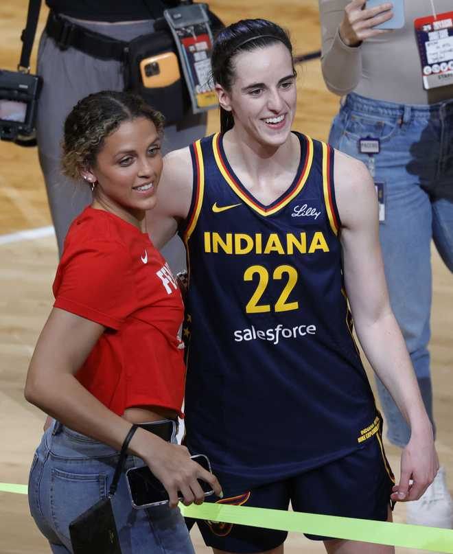 INDIANAPOLIS,&#x20;IN&#x20;-&#x20;MAY&#x20;09&#x3A;&#x20;Indiana&#x20;Fever&#x20;guard&#x20;Caitlin&#x20;Clark&#x20;&#x28;22&#x29;&#x20;with&#x20;her&#x20;former&#x20;Iowa&#x20;Hawkeyes&#x20;teammate&#x20;Gabbie&#x20;Marshall&#x20;after&#x20;a&#x20;game&#x20;against&#x20;the&#x20;Atlanta&#x20;Dream&#x20;during&#x20;a&#x20;WNBA&#x20;preseason&#x20;game&#x20;on&#x20;May&#x20;9,&#x20;2024,&#x20;at&#x20;Gainbridge&#x20;Fieldhouse&#x20;in&#x20;Indianapolis,&#x20;Indiana.&#x20;&#x28;Photo&#x20;by&#x20;Brian&#x20;Spurlock&#x2F;Icon&#x20;Sportswire&#x20;via&#x20;Getty&#x20;Images&#x29;