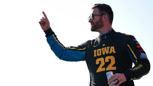 NEWTON, IOWA - JUNE 16: Corey LaJoie, driver of the #7 Gainbridge/Iowa Hawkeyes Chevrolet, reacts during driver introductions before the NASCAR Cup Series Iowa Corn 350 at Iowa Speedway on June 16, 2024 in Newton, Iowa. (Photo by James Gilbert/Getty Images)