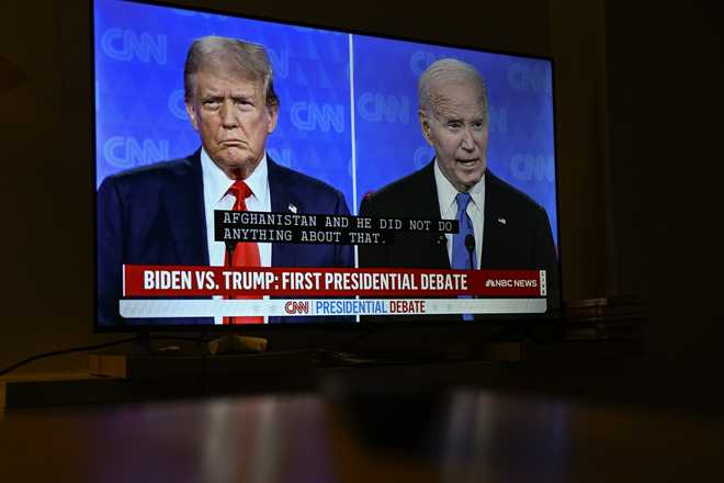 VIRGINIA, UNITED STATES - JUNE 27: President of the United States Joe Biden and Former President Donald Trump's first Presidential Debate is displayed on a TV screen in Virginia, United States on June 27, 2024. (Photo by Celal Gunes/Anadolu via Getty Images)