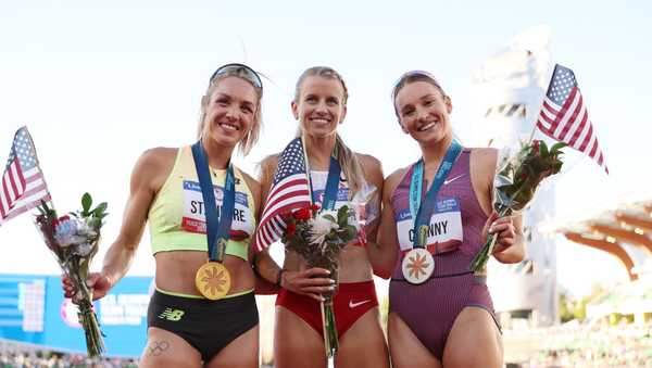 EUGENE, OREGON - JUNE 24: Elle St. Pierre, Karissa Schweizer, and Elise Cranny pose with flags and medals after competing in the women's 5000 meter final on Day Four of the 2024 U.S. Olympic Team Track & Field Trials at Hayward Field on June 24, 2024 in Eugene, Oregon. (Photo by Christian Petersen/Getty Images)