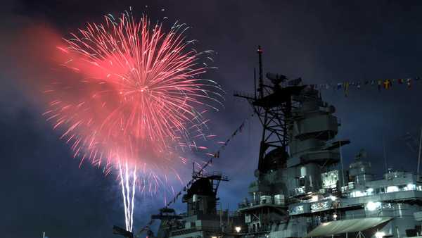 SAN PEDRO, CALIFORNIA- Fireworks explode behind the USS Iowa in San Pedro Friday night. (Wally Skalij/Los Angeles Times via Getty Images)