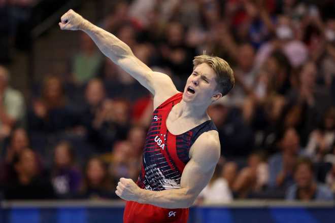 MINNEAPOLIS, MINNESOTA - JUNE 29: Shane Wiskus celebrates after competing in the floor exercise on Day Three of the 2024 U.S. Olympic Team Gymnastics Trials at Target Center on June 29, 2024 in Minneapolis, Minnesota. (Photo by Elsa/Getty Images)