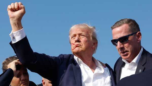 BUTLER, PENNSYLVANIA - JULY 13: Republican presidential candidate former President Donald Trump pumps his fist as he is rushed offstage during a rally on July 13, 2024 in Butler, Pennsylvania. Butler County district attorney Richard Goldinger said the shooter is dead after injuring former U.S. President Donald Trump, killing one audience member and injuring another in the shooting. (Photo by Anna Moneymaker/Getty Images)