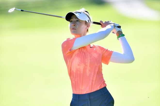 EVIAN-LES-BAINS, FRANCE - JULY 14: Nelly Korda of the United States plays her second shot on the 10th hole  during the final round of the Amundi Evian Championship at Evian Resort Golf Club on July 14, 2024 in Evian-les-Bains, France. (Photo by Valerio Pennicino/Getty Images)