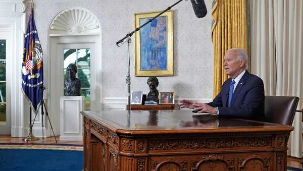 US President Joe Biden speaks during an address to the nation about his decision to not seek reelection, in the Oval Office at the White House in Washington, DC, on July 24, 2024. US President Joe Biden will give an Oval Office speech July 24, 2024 to explain his historic decision to drop out of the 2024 election and pass the torch to Kamala Harris, with the White House denying any cover up over his health. In his first address to the nation since quitting the race, the 81-year-old is expected to burnish his legacy and deny he will spend six months as a lame duck president. (Photo by Evan Vucci / POOL / AFP) (Photo by EVAN VUCCI/POOL/AFP via Getty Images)