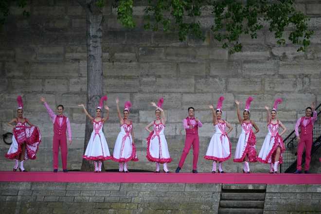 PARIS,&#x20;FRANCE&#x20;-&#x20;JULY&#x20;26&#x3A;&#x20;Dancers&#x20;performing&#x20;French&#x20;Cancan&#x20;choreography&#x20;as&#x20;part&#x20;of&#x20;one&#x20;of&#x20;twelve&#x20;artistic&#x20;tableaux,&#x20;are&#x20;pictured&#x20;from&#x20;the&#x20;boat&#x20;of&#x20;Brazil&amp;apos&#x3B;s&#x20;delegation&#x20;&#x20;sailing&#x20;along&#x20;the&#x20;river&#x20;Seine&#x20;during&#x20;the&#x20;opening&#x20;ceremony&#x20;of&#x20;the&#x20;Olympic&#x20;Games&#x20;Paris&#x20;2024&#x20;on&#x20;July&#x20;26,&#x20;2024&#x20;in&#x20;Paris,&#x20;France.&#x20;&#x28;Photo&#x20;by&#x20;Carl&#x20;de&#x20;Souza-Pool&#x2F;Getty&#x20;Images&#x29;