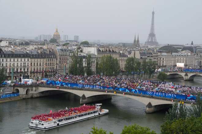 PARIS,&#x20;FRANCE&#x20;-&#x20;JULY&#x20;26&#x3A;&#x20;Athletes&#x20;of&#x20;Team&#x20;Canada&#x20;travel&#x20;by&#x20;boat&#x20;along&#x20;the&#x20;Seine&#x20;river&#x20;during&#x20;the&#x20;opening&#x20;ceremony&#x20;of&#x20;the&#x20;Olympic&#x20;Games&#x20;Paris&#x20;2024&#x20;on&#x20;July&#x20;26,&#x20;2024&#x20;in&#x20;Paris,&#x20;France.&#x20;&#x28;Photo&#x20;by&#x20;Ricardo&#x20;Mazalan&#x20;-&#x20;Pool&#x2F;Getty&#x20;Images&#x29;