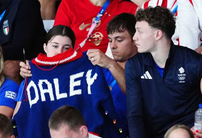Great&#x20;Britain&amp;apos&#x3B;s&#x20;Tom&#x20;Daley&#x20;knitting&#x20;as&#x20;he&#x20;watches&#x20;the&#x20;Women&amp;apos&#x3B;s&#x20;Synchronised&#x20;3m&#x20;Springboard&#x20;Final&#x20;at&#x20;the&#x20;Aquatics&#x20;Centre&#x20;on&#x20;the&#x20;first&#x20;day&#x20;of&#x20;the&#x20;2024&#x20;Paris&#x20;Olympic&#x20;Games&#x20;in&#x20;France.&#x20;Picture&#x20;date&#x3A;&#x20;Saturday&#x20;July&#x20;27,&#x20;2024.&#x20;&#x28;Photo&#x20;by&#x20;Mike&#x20;Egerton&#x2F;PA&#x20;Images&#x20;via&#x20;Getty&#x20;Images&#x29;