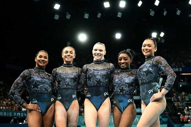 &#x28;From&#x20;L&#x29;&#x20;US&amp;apos&#x3B;&#x20;Jordan&#x20;Chiles,&#x20;US&amp;apos&#x3B;&#x20;Hezly&#x20;Rivera,&#x20;US&amp;apos&#x3B;&#x20;Jade&#x20;Carey,&#x20;US&amp;apos&#x3B;&#x20;Simone&#x20;Biles&#x20;and&#x20;US&amp;apos&#x3B;&#x20;Sunisa&#x20;Lee&#x20;pose&#x20;during&#x20;the&#x20;artistic&#x20;gymnastics&#x20;women&amp;apos&#x3B;s&#x20;qualification&#x20;during&#x20;the&#x20;Paris&#x20;2024&#x20;Olympic&#x20;Games&#x20;at&#x20;the&#x20;Bercy&#x20;Arena&#x20;in&#x20;Paris,&#x20;on&#x20;July&#x20;28,&#x20;2024.&#x20;&#x28;Photo&#x20;by&#x20;Loic&#x20;VENANCE&#x20;&#x2F;&#x20;AFP&#x29;&#x20;&#x28;Photo&#x20;by&#x20;LOIC&#x20;VENANCE&#x2F;AFP&#x20;via&#x20;Getty&#x20;Images&#x29;