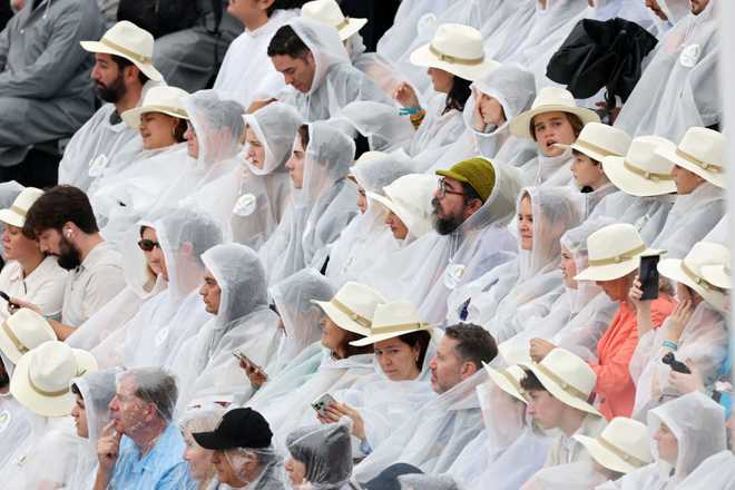 PARIS,&#x20;FRANCE&#x20;-&#x20;JULY&#x20;26&#x3A;&#x20;Spectators&#x20;wearing&#x20;rain&#x20;ponchos&#x20;look&#x20;on&#x20;during&#x20;the&#x20;opening&#x20;ceremony&#x20;of&#x20;the&#x20;Olympic&#x20;Games&#x20;Paris&#x20;2024&#x20;on&#x20;July&#x20;26,&#x20;2024&#x20;in&#x20;Paris,&#x20;France.&#x20;&#x28;Photo&#x20;by&#x20;Jamie&#x20;Squire&#x2F;Getty&#x20;Images&#x29;
