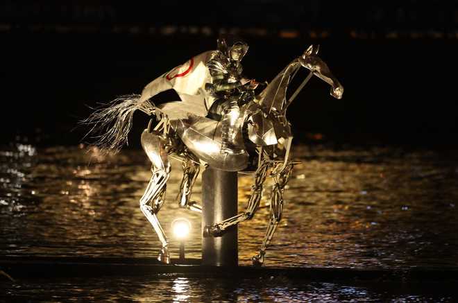 PARIS,&#x20;FRANCE&#x20;-&#x20;JULY&#x20;26&#x3A;&#x20;The&#x20;Horsewoman,&#x20;wearing&#x20;the&#x20;Flag&#x20;of&#x20;the&#x20;International&#x20;Olympic&#x20;Committee&#x20;&#x28;IOC&#x29;,&#x20;is&#x20;seen&#x20;on&#x20;a&#x20;Metal&#x20;Horse&#x20;on&#x20;the&#x20;River&#x20;Seine&#x20;during&#x20;the&#x20;opening&#x20;ceremony&#x20;of&#x20;the&#x20;Olympic&#x20;Games&#x20;Paris&#x20;2024&#x20;on&#x20;July&#x20;26,&#x20;2024&#x20;in&#x20;Paris,&#x20;France.&#x20;&#x28;Photo&#x20;by&#x20;Richard&#x20;Pelham&#x2F;Getty&#x20;Images&#x29;