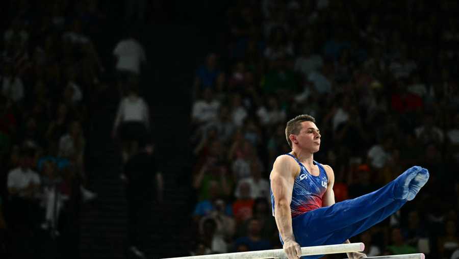 Paul Juda competes in the parallel bars event of the artistic gymnastics men's all-around final during the Paris 2024 Olympic Games at the Bercy Arena in Paris, on July 31, 2024. (Photo by Gabriel BOUYS / AFP) (Photo by GABRIEL BOUYS/AFP via Getty Images)