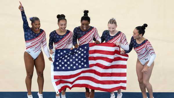 PARIS, FRANCE - JULY 30: (L-R) Jordan Chiles, Hezly Rivera,  Simone Biles, Jade Carey and Sunisa Lee of Team United States celebrate during the Artistic Gymnastics Women's Team Final on day four of the Olympic Games Paris 2024 at Bercy Arena on July 30, 2024 in Paris, France. (Photo by Ezra Shaw/Getty Images)