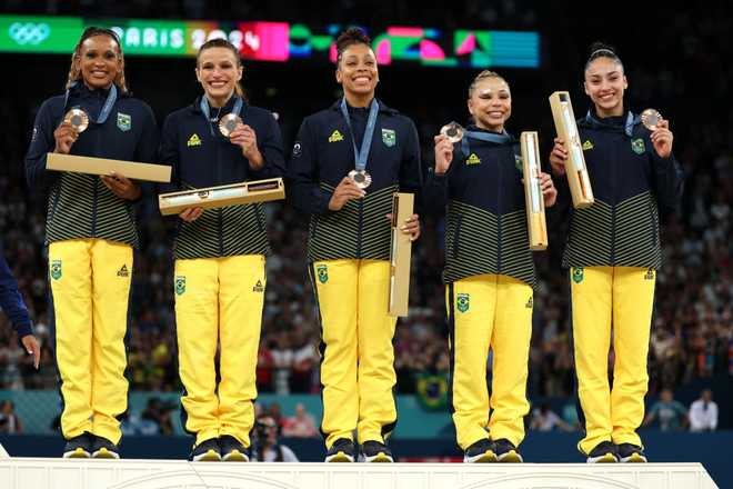 PARIS,&#x20;FRANCE&#x20;-&#x20;JULY&#x20;30&#x3A;&#x20;Bronze&#x20;medalists&#x20;Team&#x20;Brazil&#x20;celebrate&#x20;on&#x20;the&#x20;podium&#x20;during&#x20;the&#x20;medal&#x20;ceremony&#x20;for&#x20;the&#x20;Artistic&#x20;Gymnastics&#x20;Women&amp;apos&#x3B;s&#x20;Team&#x20;Final&#x20;on&#x20;day&#x20;four&#x20;of&#x20;the&#x20;Olympic&#x20;Games&#x20;Paris&#x20;2024&#x20;at&#x20;Bercy&#x20;Arena&#x20;on&#x20;July&#x20;30,&#x20;2024&#x20;in&#x20;Paris,&#x20;France.&#x20;&#x28;Photo&#x20;by&#x20;Naomi&#x20;Baker&#x2F;Getty&#x20;Images&#x29;