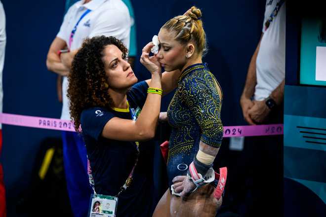 PARIS,&#x20;FRANCE&#x20;-&#x20;JULY&#x20;30&#x3A;&#x20;Flavia&#x20;Saraiva&#x20;of&#x20;Team&#x20;Brazil&#x20;receives&#x20;medical&#x20;treatment&#x20;during&#x20;the&#x20;Artistic&#x20;Gymnastics&#x20;Women&amp;apos&#x3B;s&#x20;Team&#x20;Final&#x20;on&#x20;day&#x20;four&#x20;of&#x20;the&#x20;Olympic&#x20;Games&#x20;Paris&#x20;2024&#x20;at&#x20;the&#x20;Bercy&#x20;Arena&#x20;on&#x20;July&#x20;30,&#x20;2024&#x20;in&#x20;Paris,&#x20;France.&#x20;&#x28;Photo&#x20;by&#x20;Tom&#x20;Weller&#x2F;VOIGT&#x2F;GettyImages&#x29;