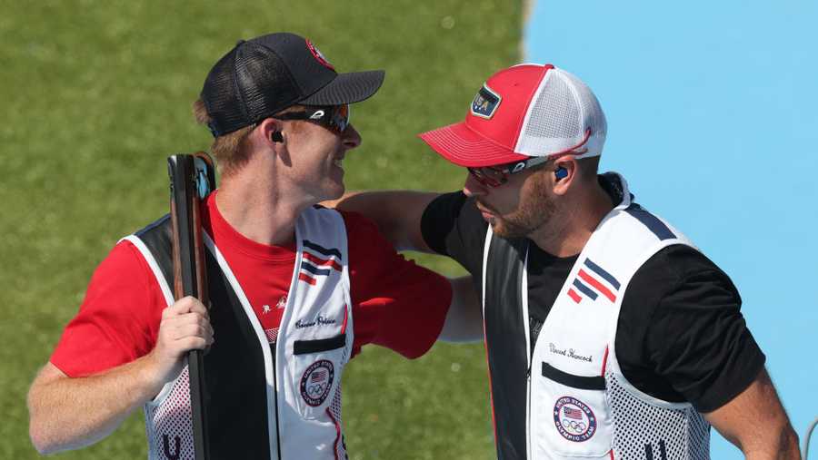 CHATEAUROUX, FRANCE - AUGUST 03: Vincent Hancock (R) and Conner Lynn Prince (L) of Team United States embrace as they win gold and silver medals respectively after competing in the Shooting Skeet Men&apos;s Final on day eight of the Olympic Games Paris 2024 at Chateauroux Shooting Centre on August 03, 2024 in Chateauroux, France. (Photo by Charles McQuillan/Getty Images)