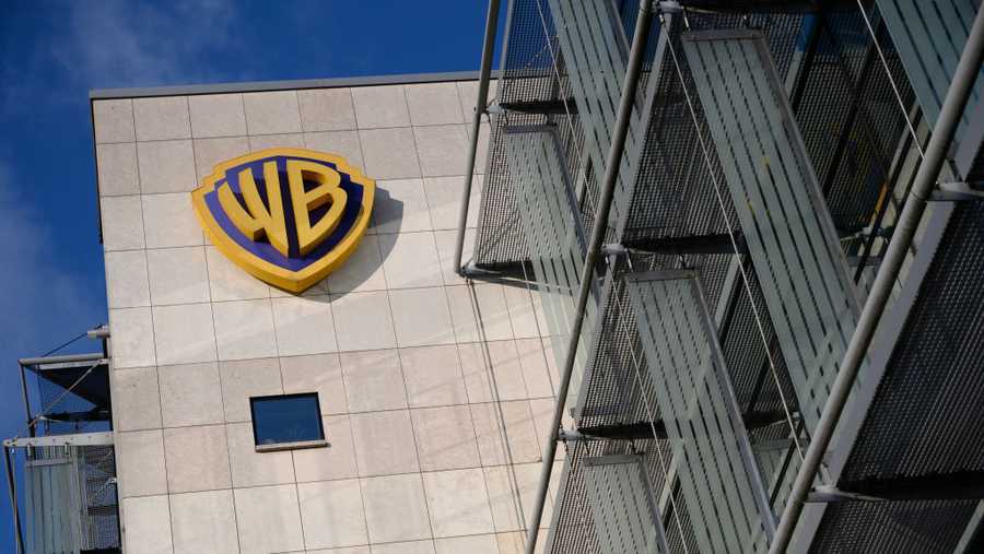 A Warner Bros (Discovery) sign is being pictured at the TVN broadcaster headquarters in Warsaw, Poland, on August 6, 2024. Warner Bros Discovery is looking to offload smaller assets in a bid to avoid a breakup of the company. (Photo by Aleksander Kalka/NurPhoto via Getty Images)