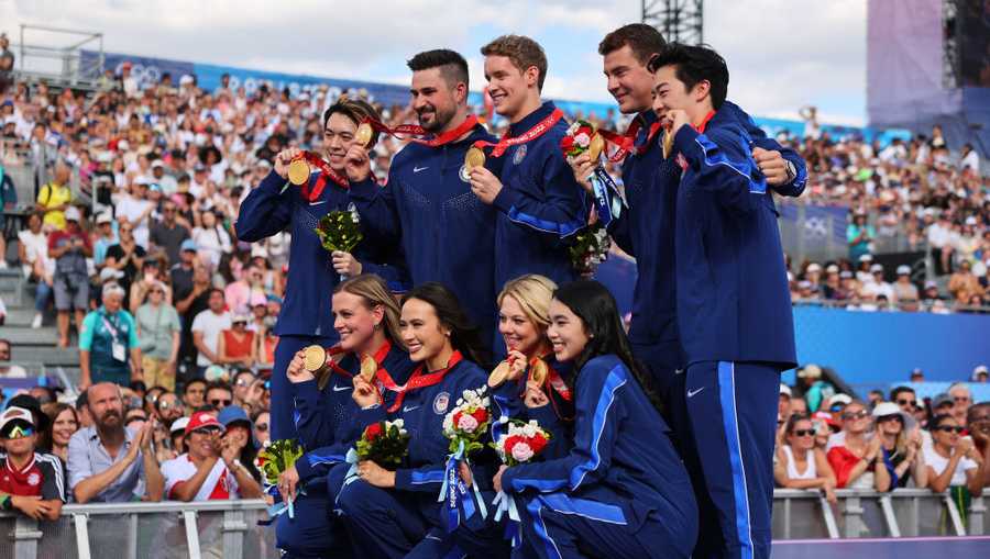 PARIS, FRANCE - AUGUST 07: Members of the U.S. Olympic figure skating team pose for a photo after receiving gold medals following the disqualification of Team Russia for doping after the 2022 Winter Games in Beijing on day twelve of the Olympic Games Paris 2024 at Champions Park on August 07, 2024 in Paris, France. (Photo by Michael Reaves/Getty Images)