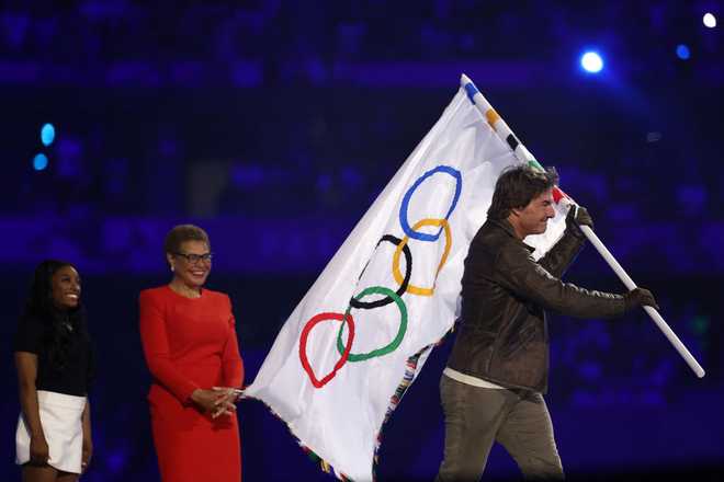 US&amp;apos&#x3B;&#x20;actor&#x20;Tom&#x20;Cruise&#x20;leaves&#x20;with&#x20;the&#x20;Olympic&#x20;flag&#x20;in&#x20;front&#x20;of&#x20;Los&#x20;Angeles&amp;apos&#x3B;&#x20;Mayor&#x20;Karen&#x20;Bass&#x20;during&#x20;the&#x20;closing&#x20;ceremony&#x20;of&#x20;the&#x20;Paris&#x20;2024&#x20;Olympic&#x20;Games&#x20;at&#x20;the&#x20;Stade&#x20;de&#x20;France,&#x20;in&#x20;Saint-Denis,&#x20;in&#x20;the&#x20;outskirts&#x20;of&#x20;Paris,&#x20;on&#x20;August&#x20;11,&#x20;2024.&#x20;&#x28;Photo&#x20;by&#x20;Franck&#x20;FIFE&#x20;&#x2F;&#x20;AFP&#x29;&#x20;&#x28;Photo&#x20;by&#x20;FRANCK&#x20;FIFE&#x2F;AFP&#x20;via&#x20;Getty&#x20;Images&#x29;