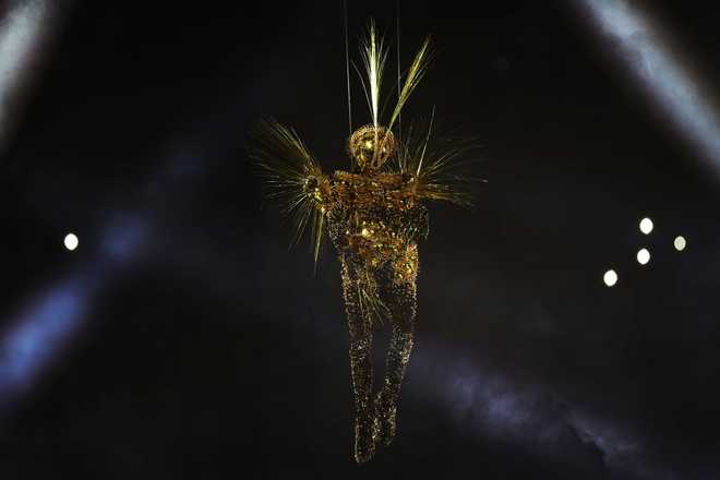 PARIS, FRANCE - AUGUST 11: The Golden Voyager descends into the Stadium as a light show takes place during the Closing Ceremony of the Olympic Games Paris 2024 at Stade de France on August 11, 2024 in Paris, France. (Photo by Jamie Squire/Getty Images)