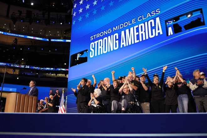 US Senator from Michigan Gary Peters (L) speaks alongside retired teamsters on the second day of the Democratic National Convention (DNC) at the United Center in Chicago, Illinois, on August 20, 2024. Vice President Kamala Harris will formally accept the party's nomination for president at the DNC which runs from August 19-22 in Chicago. (Photo by CHARLY TRIBALLEAU / AFP) (Photo by CHARLY TRIBALLEAU/AFP via Getty Images)