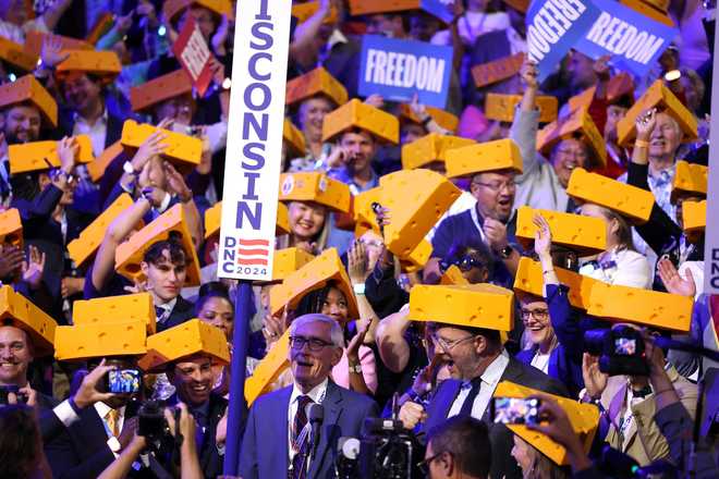 Wisconsin&#x20;delegates&#x20;cast&#x20;their&#x20;vote&#x20;during&#x20;the&#x20;ceremonial&#x20;roll&#x20;call&#x20;vote&#x20;on&#x20;the&#x20;second&#x20;day&#x20;of&#x20;the&#x20;Democratic&#x20;National&#x20;Convention&#x20;&#x28;DNC&#x29;&#x20;at&#x20;the&#x20;United&#x20;Center&#x20;in&#x20;Chicago,&#x20;Illinois,&#x20;on&#x20;August&#x20;20,&#x20;2024.&#x20;Vice&#x20;President&#x20;Kamala&#x20;Harris&#x20;will&#x20;formally&#x20;accept&#x20;the&#x20;party&#x27;s&#x20;nomination&#x20;for&#x20;president&#x20;at&#x20;the&#x20;DNC&#x20;which&#x20;runs&#x20;from&#x20;August&#x20;19-22&#x20;in&#x20;Chicago.&#x20;&#x28;Photo&#x20;by&#x20;CHARLY&#x20;TRIBALLEAU&#x20;&#x2F;&#x20;AFP&#x29;&#x20;&#x28;Photo&#x20;by&#x20;CHARLY&#x20;TRIBALLEAU&#x2F;AFP&#x20;via&#x20;Getty&#x20;Images&#x29;