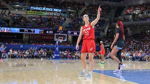 CHICAGO, IL - AUGUST 30: Caitlin Clark #22 of the Indiana Fever points to the score board after a fan interaction during the second half of a WNBA game against the Chicago Sky on August 30, 2024 at Wintrust Arena in Chicago, Illinois. (Photo by Melissa Tamez/Icon Sportswire via Getty Images)