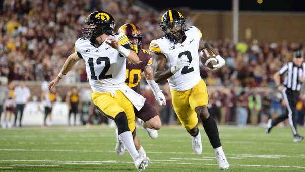 MINNEAPOLIS, MN - SEPTEMBER 21: Iowa Hawkeyes RB Kaleb Johnson (2) follows QB Cade McNamara (12) to score a touchdown during football game between the Iowa Hawkeyes and the Minnesota Golden Gophers on September 21, 2024, at Huntington Bank Stadium in Minneapolis, MN. (Photo by John Rivera/Icon Sportswire via Getty Images)