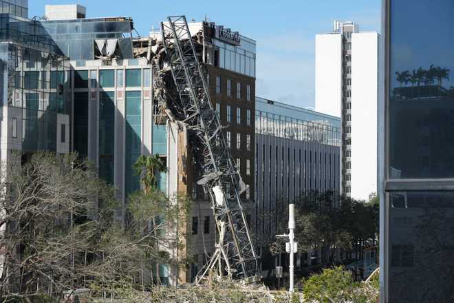 Photos: Hurricane Milton rips off roofs, overturns cars, sparks ...