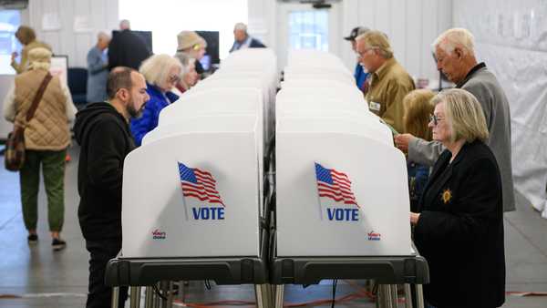 HENDERSONVILLE, NORTH CAROLINA - OCTOBER 17:  Voters make selections at their voting booths inside an early voting site on October 17, 2024 in Hendersonville, North Carolina. Several counties effected by Hurricane Helene saw a large turnout of residents for the first day of early voting in Western North Carolina. (Photo by Melissa Sue Gerrits/Getty Images)