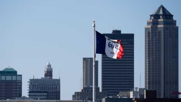 UNITED STATES - OCTOBER 18: The Iiowa state flag flies on the grounds of the Iowa State Capitol, commonly called the Iowa Statehouse, with the Des Moines, Iowa skyline in the background on Friday, October 18, 2024. (Bill Clark/CQ-Roll Call, Inc via Getty Images)