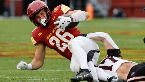 AMES, IA - NOVEMBER 02: Running back Carson Hansen #26 of the Iowa State Cyclones is tackled by linebacker Isaac Smith #17 of the Texas Tech Red Raiders as he rushed for yards in the first half of play at Jack Trice Stadium on November 2, 2024, in Ames, Iowa. (Photo by David Purdy/Getty Images)