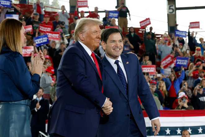 RALEIGH, NORTH CAROLINA - NOVEMBER 04:  Republican presidential nominee, former U.S. President Donald Trump appears stage with U.S. Sen. Marco Rubio (R-FL) (R) and Arkansas Gov. Sarah Huckabee Sanders during a campaign rally at the J.S. Dorton Arena on November 04, 2024 in Raleigh, North Carolina. With one day left before the general election, Trump is campaigning for re-election in the battleground states of North Carolina, Pennsylvania and Michigan.  (Photo by Chip Somodevilla/Getty Images)