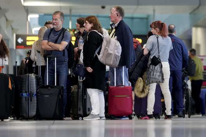 Travelers&#x20;pass&#x20;through&#x20;the&#x20;Miami&#x20;International&#x20;Airport&#x20;on&#x20;Dec.&#x20;20,&#x20;2024,&#x20;as&#x20;some&#x20;of&#x20;the&#x20;year&#x27;s&#x20;busiest&#x20;travel&#x20;days&#x20;occur&#x20;during&#x20;the&#x20;holiday&#x20;season&#x20;in&#x20;Miami,&#x20;Florida.