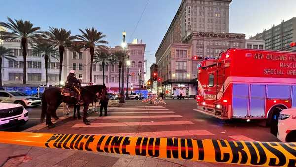 Police cordon off the intersection of Canal Street and Bourbon Street in the French Quarter of New Orleans, Louisiana, on January 1, 2025. At least 10 people were killed and 30 injured Wednesday when a vehicle plowed overnight into a New year's crowd in the heart of the thriving New Orleans tourist district, authorities in the southern US city said. (Photo by Matthew HINTON / AFP) (Photo by MATTHEW HINTON/AFP via Getty Images)