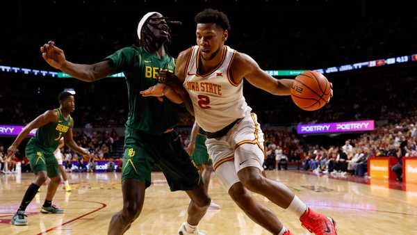 AMES, IA - JANUARY 4: Joshua Jefferson #2 of the Iowa State Cyclones drives the ball as Jason Asemota #5 of the Baylor Bears puts pressure on in the first half of play at Hilton Coliseum on January 4, 2025, in Ames, Iowa. (Photo by David Purdy/Getty Images)