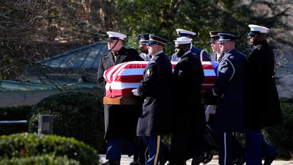 The casket of former President Jimmy Carter is carried by a joint services body bearer team from the Jimmy Carter Presidential Library and Museum in Atlanta, Georgia on January 7, 2025.